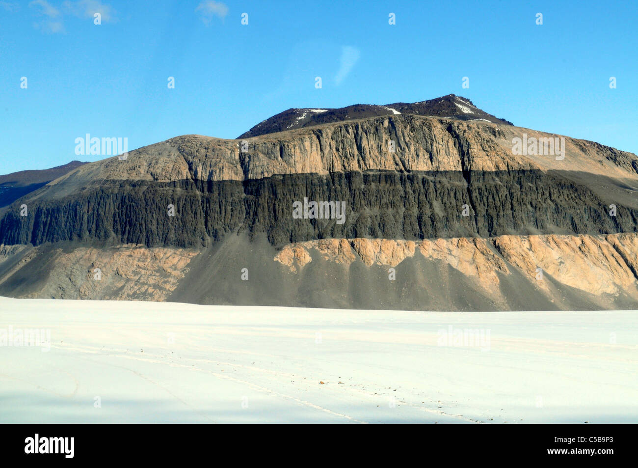 Prominent dolerite rock layer in sandstone, Pandora Spire upper Taylor Glacier McMurdo Dry Valleys Antarctica Stock Photo
