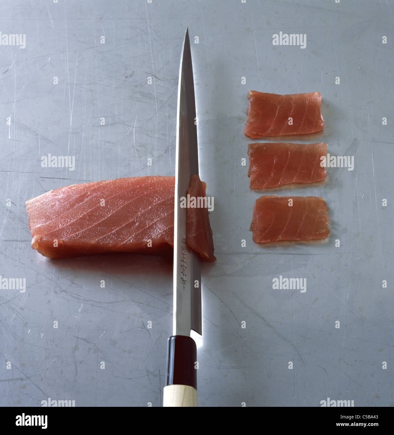 Nigiri Sushi Cutting tuna fillet Stock Photo Alamy