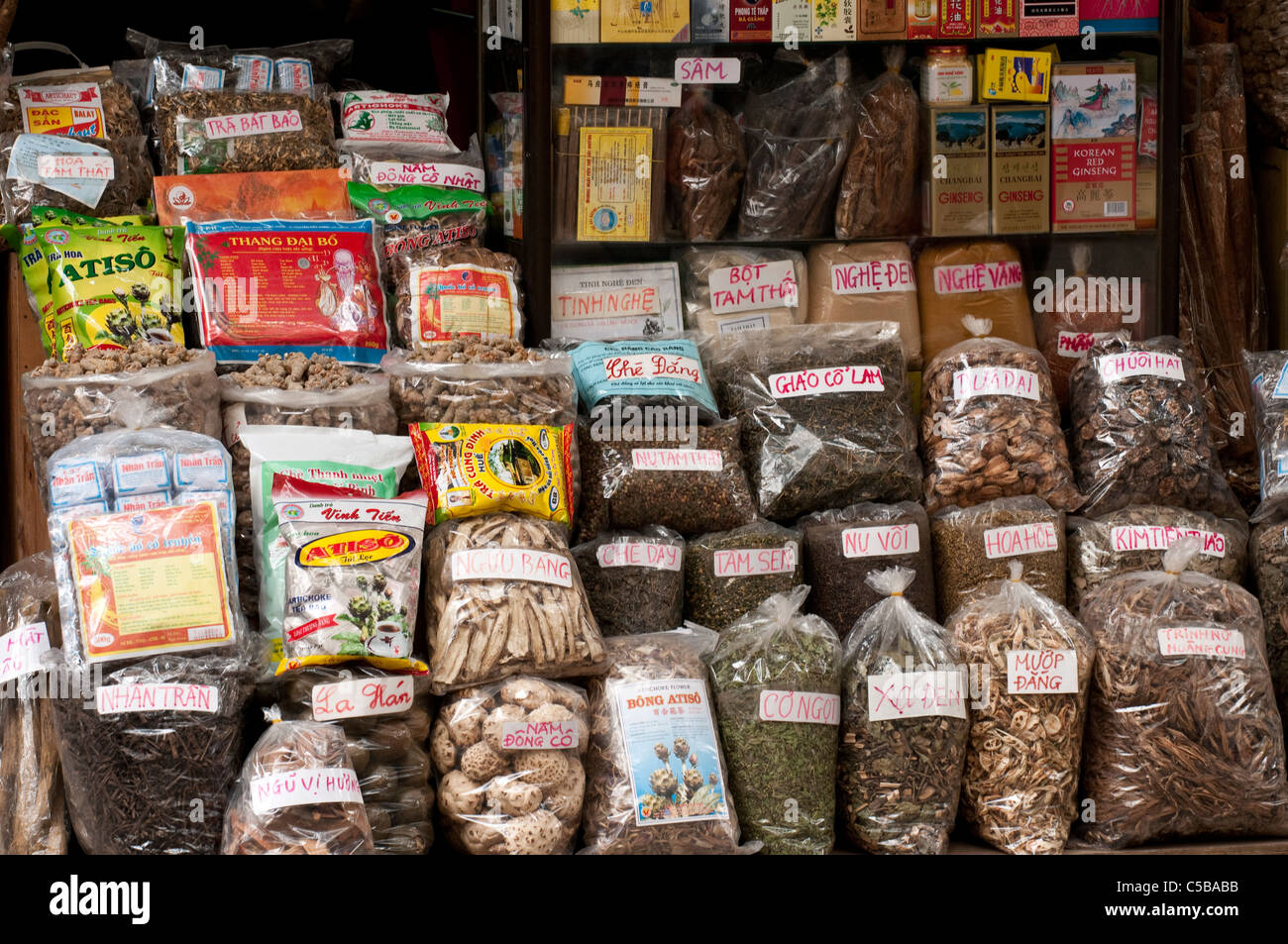 Bags and packets of medicinal herbs and teas in a shop in Lan Ong St, Hanoi Old Quarter, Vietnam Stock Photo