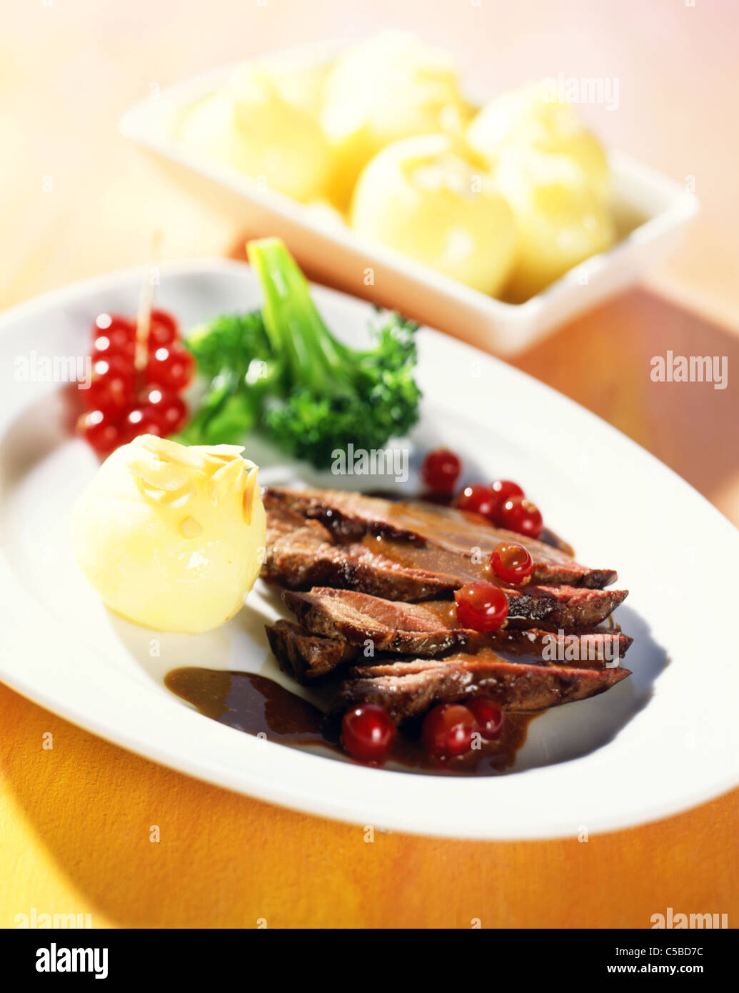 Deer shoulder with currant sauce Stock Photo
