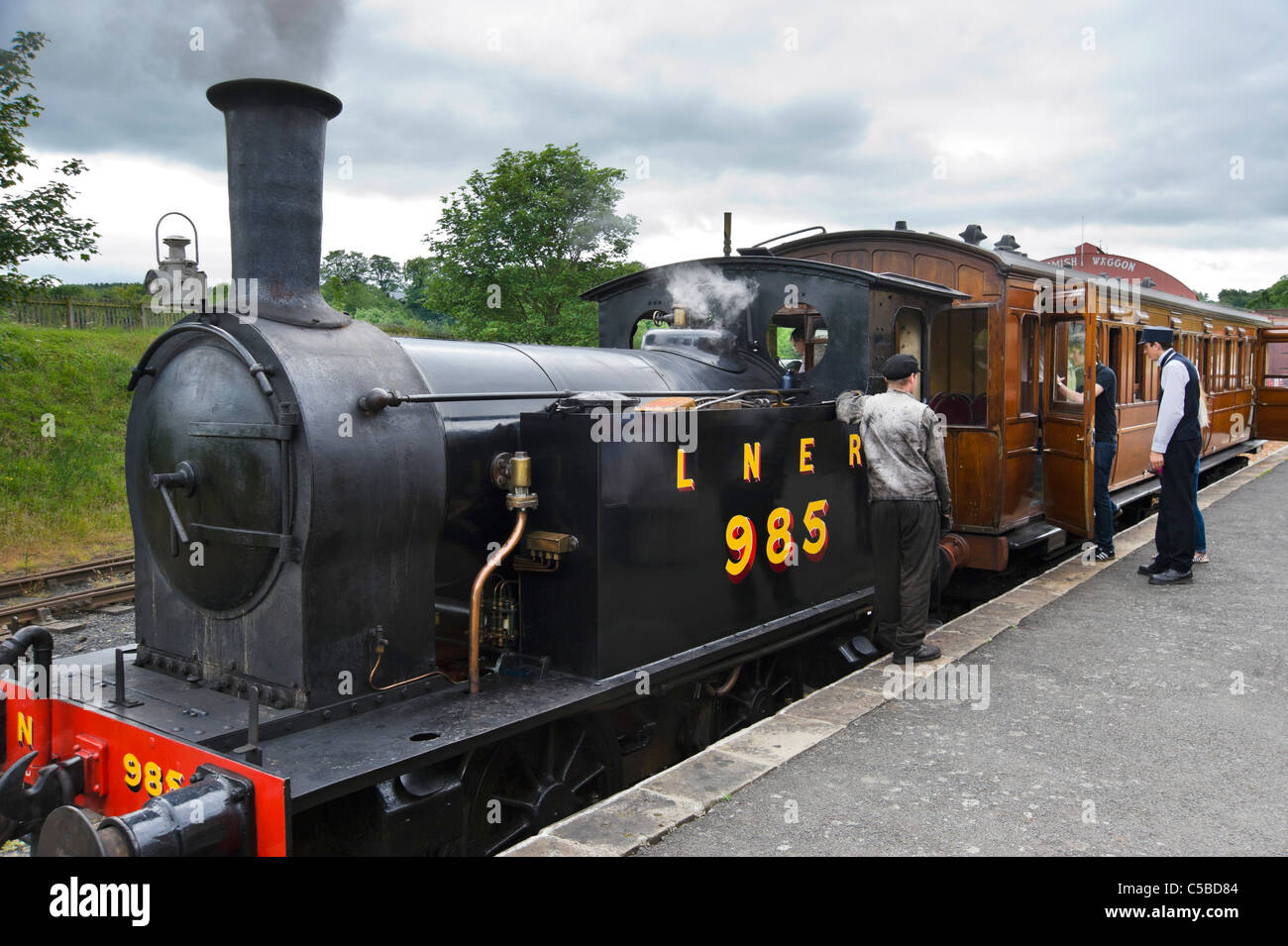 Old steam train on the platform at the railway station, Beamish Open Air Museum, County Durham, North East England, UK Stock Photo