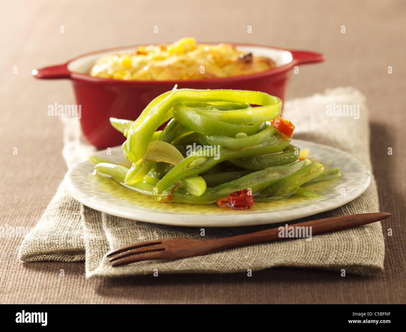 Spicy green beans with mealie bread Stock Photo Alamy