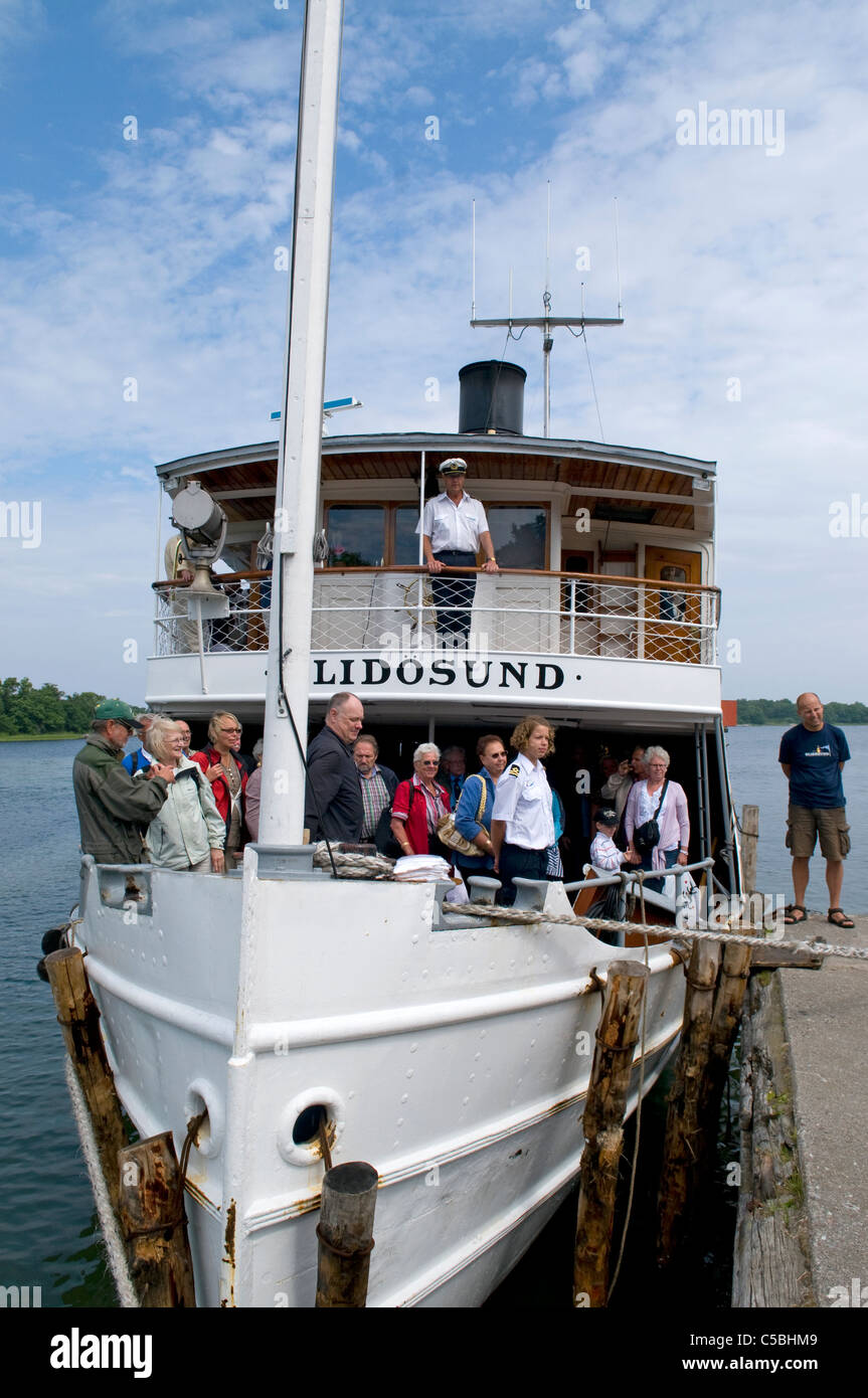 Stockholm archipelago's last coal-fired steamboat The S/S Blidösund celebrating its 100th birthday on the island of Rödlöga. Stock Photo