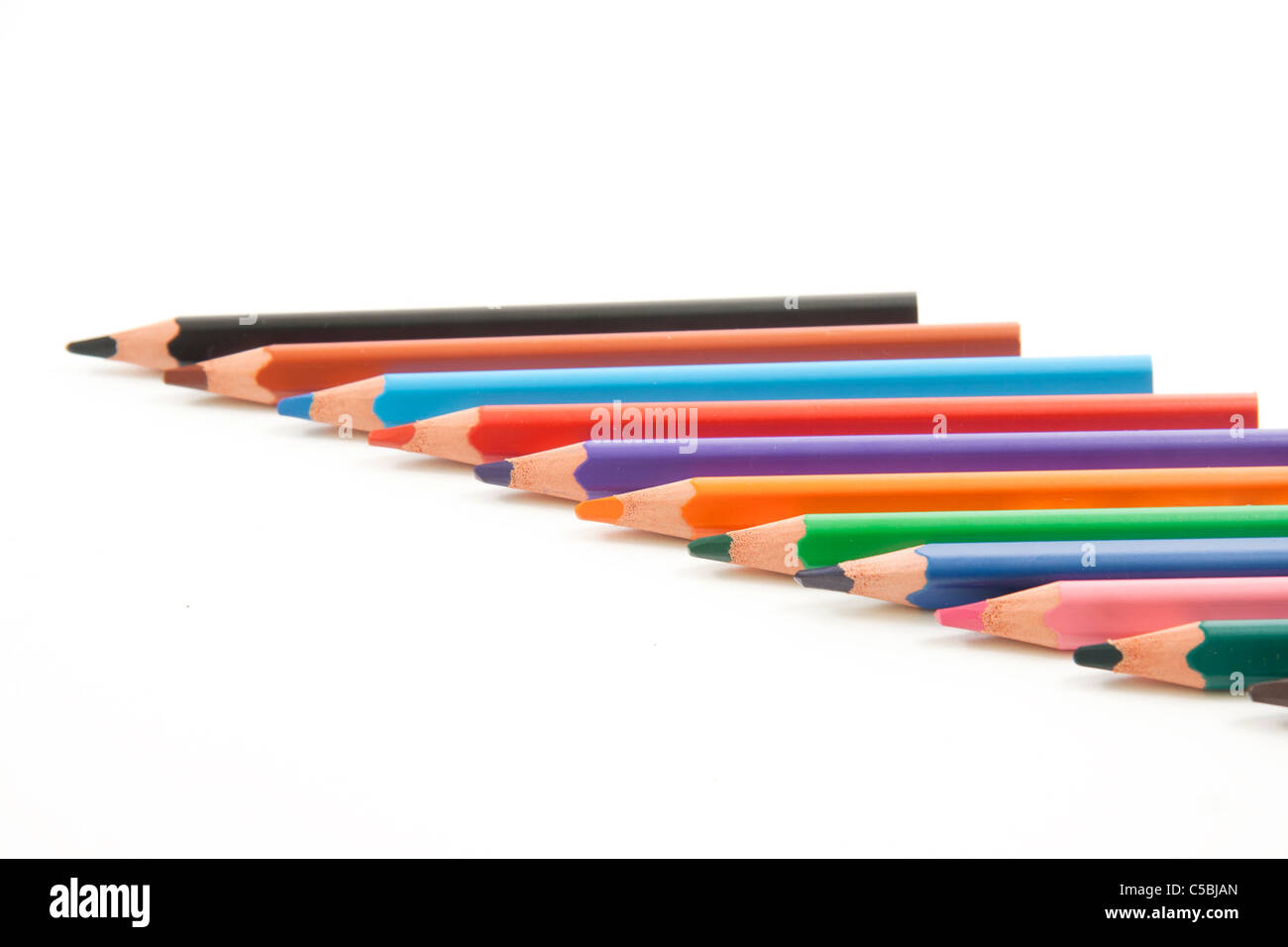 Assorted colored pencils lined up horizontally as crosswise to the