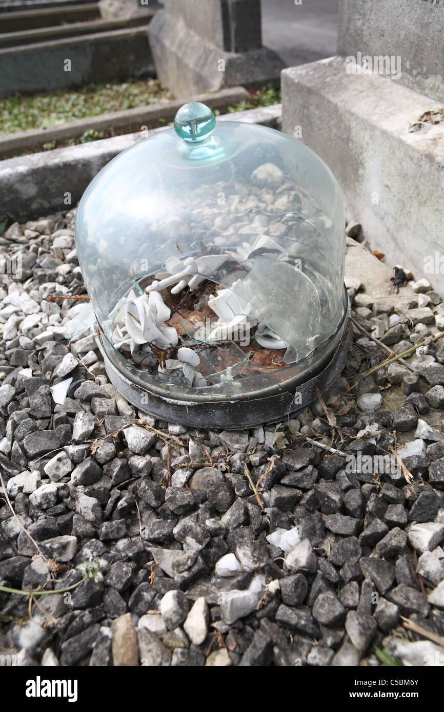 Broken bell jar at a grave Stock Photo