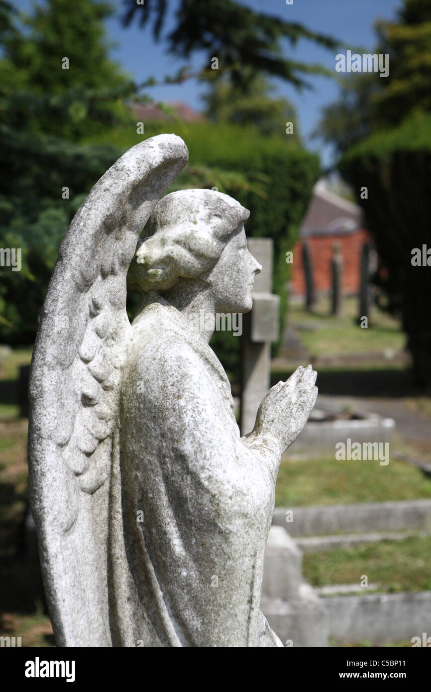 Side view of angel statue hi-res stock photography and