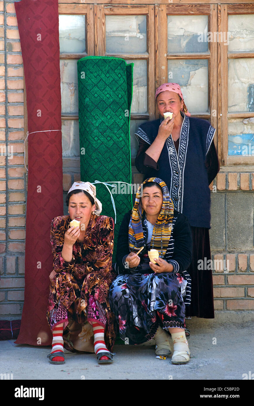 Uzbeki women eating ice cream. Urgut market, Samarkand, Uzbekistan ...