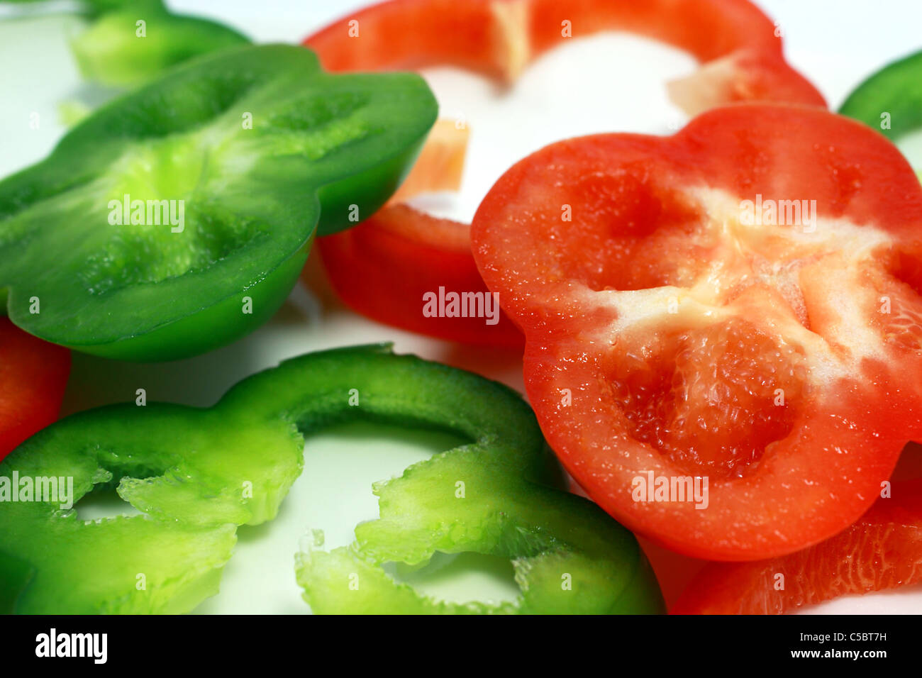 background of sliced red and green pepper Stock Photo - Alamy
