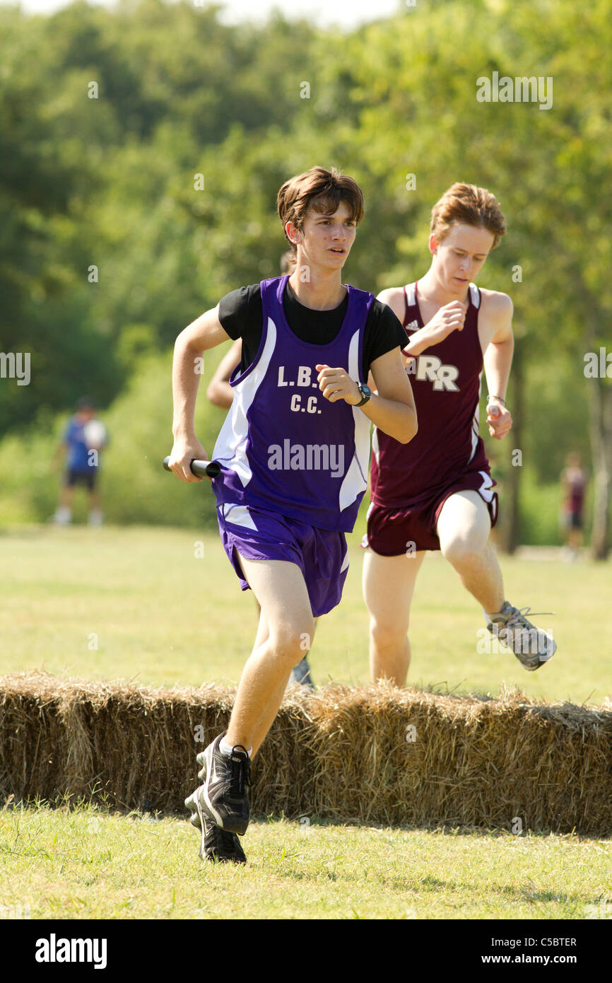 Pflugerville Texas USA, August 27, 2010: White male athlete in track uniform competes in high school cross country meet. ©Bob Daemmrich Stock Photo