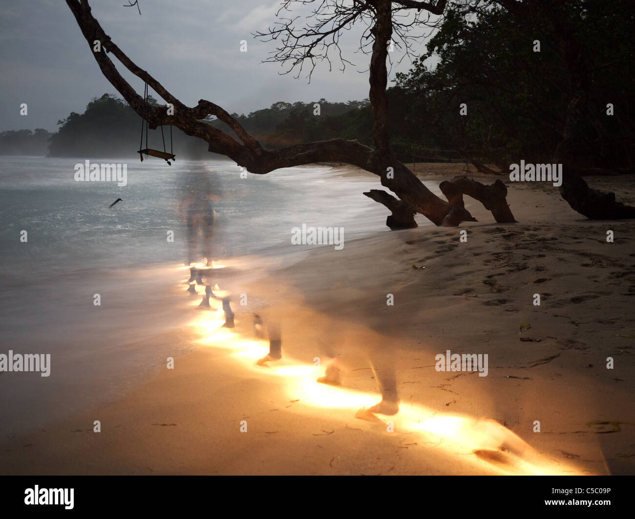 Footsteps at night on beach Stock Photo Alamy