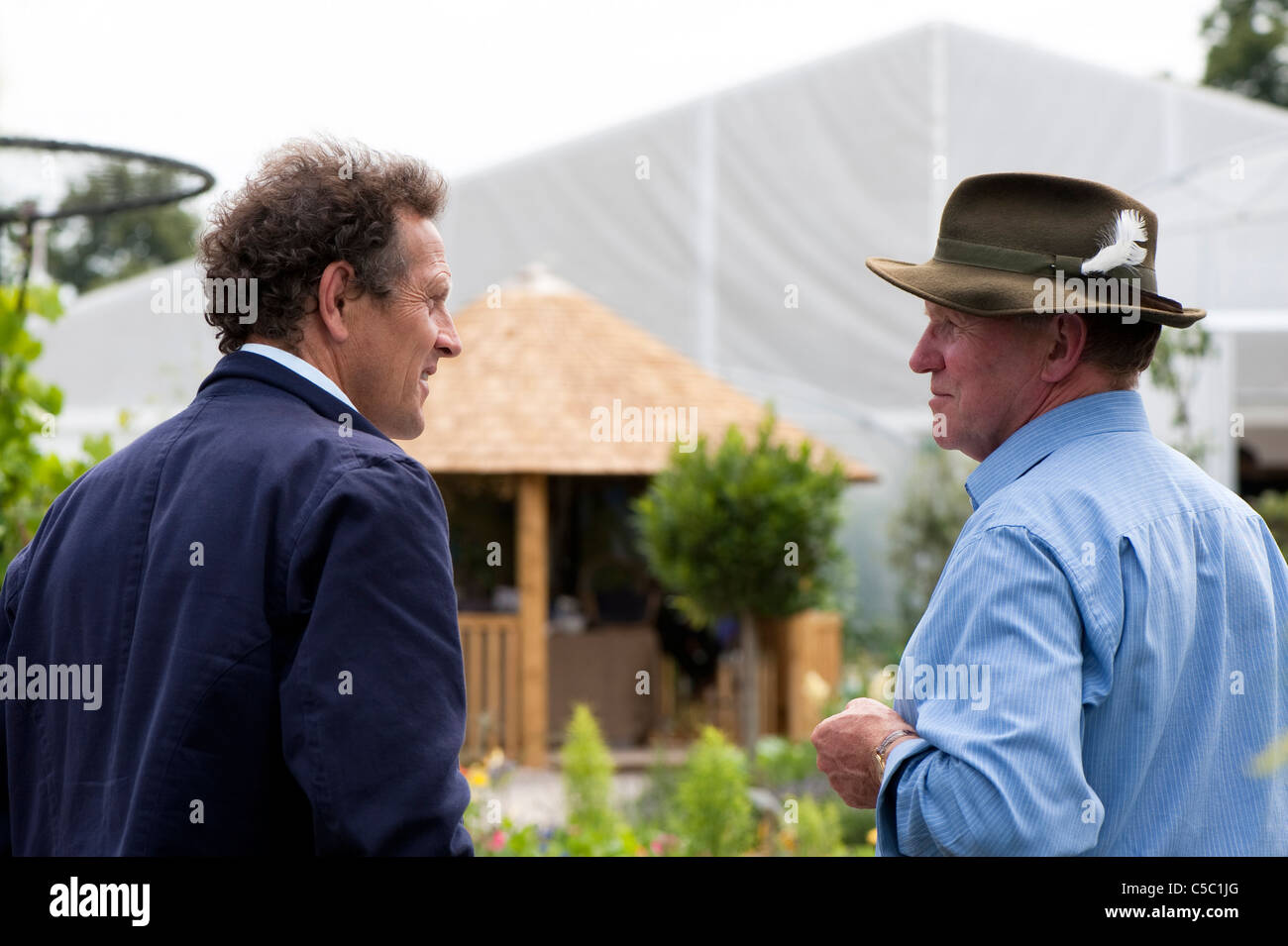 Monty Don talking to John Wheatley, designer of The RHS Edible Garden at 2011 Hampton Court Palace Flower Show, UK Stock Photo