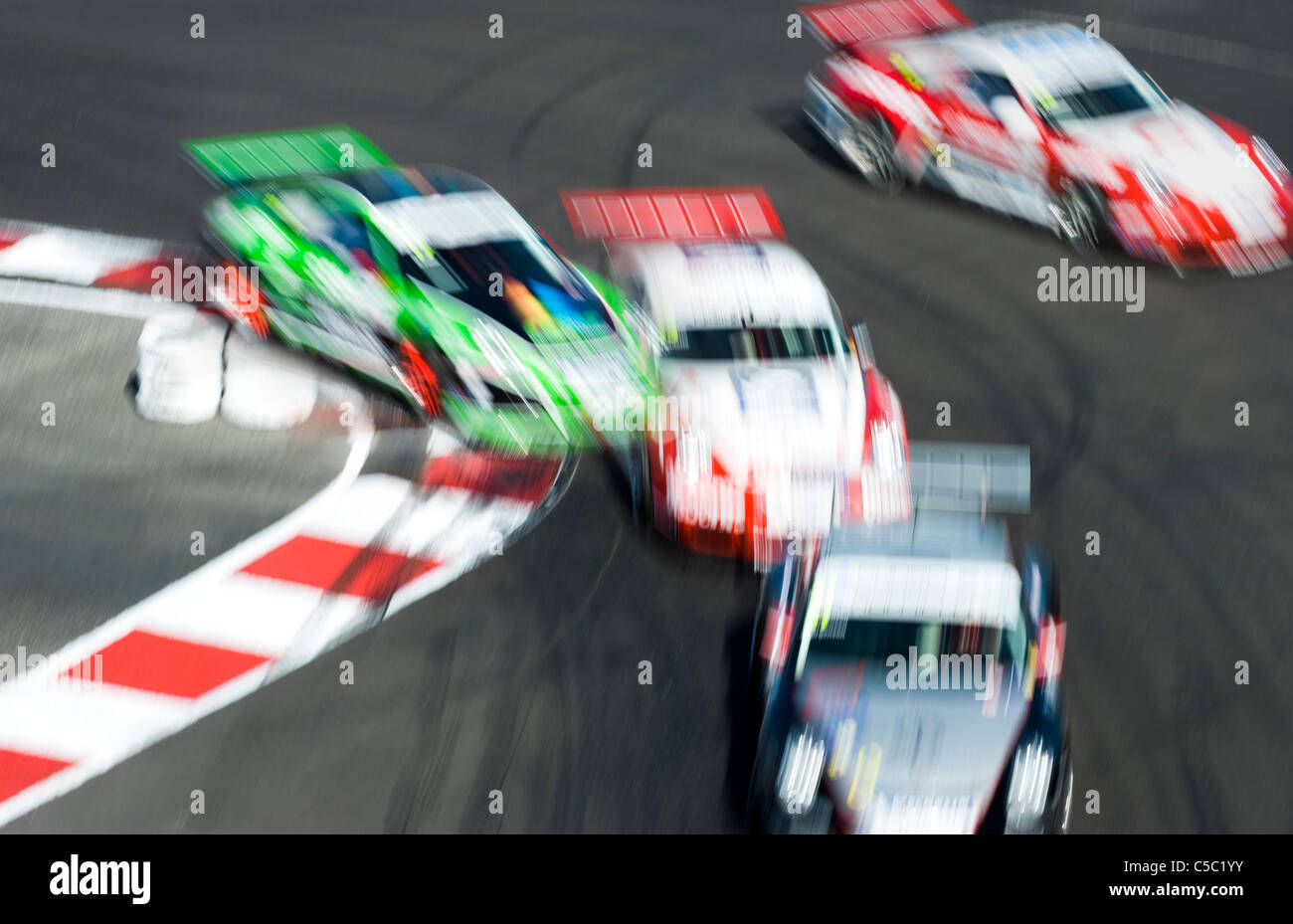 Motion blurred shot of racing cars Stock Photo