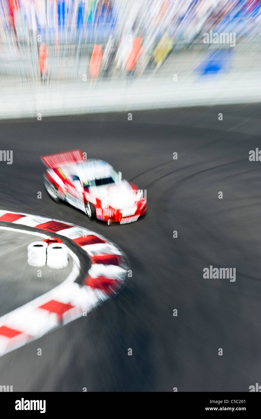 Motion blurred shot of a racing car Stock Photo