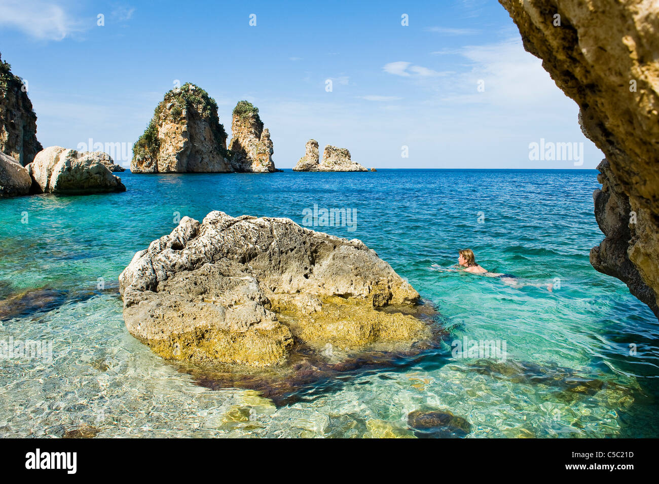 Woman swims in the Mediterranean sea, Sicily, Italy Stock Photo