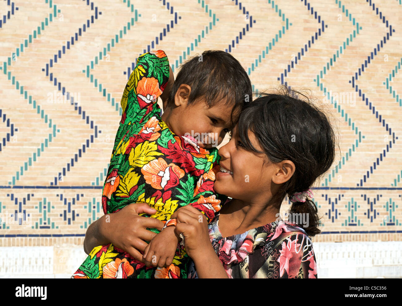 Uzbeki child and younger sister, Samarkand, Uzbekistan Stock Photo