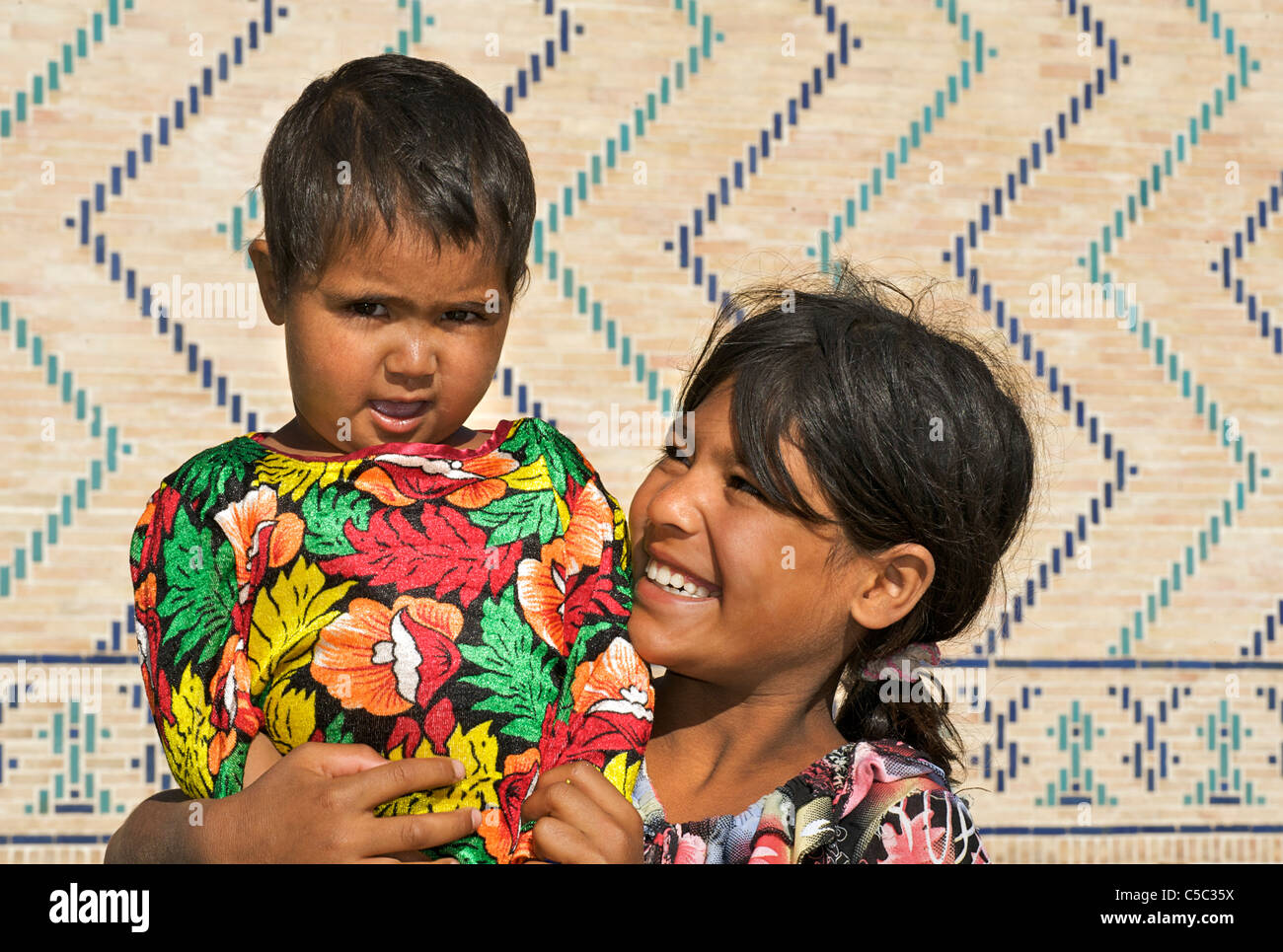 Uzbeki child and younger sister, Samarkand, Uzbekistan Stock Photo