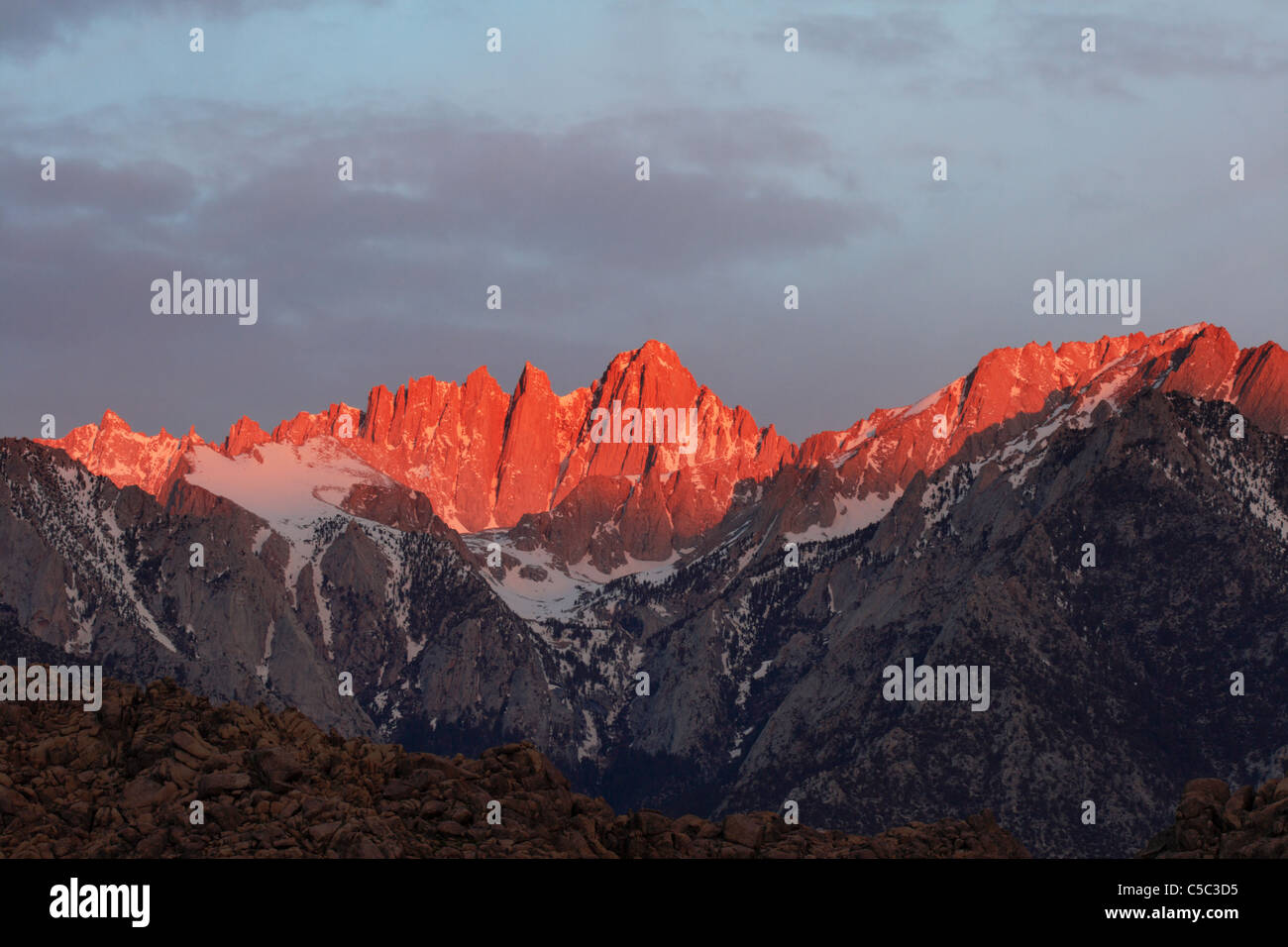 Mount Whitney the highest point in the lower 48 states lit by early morning alpenglow Stock Photo