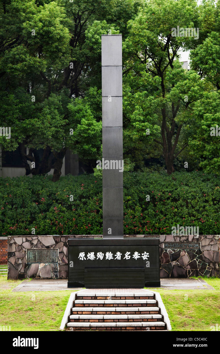 A Monument And Sign Commemorating The Atomic Bomb During World War Two; Nagasaki, Japan Stock Photo