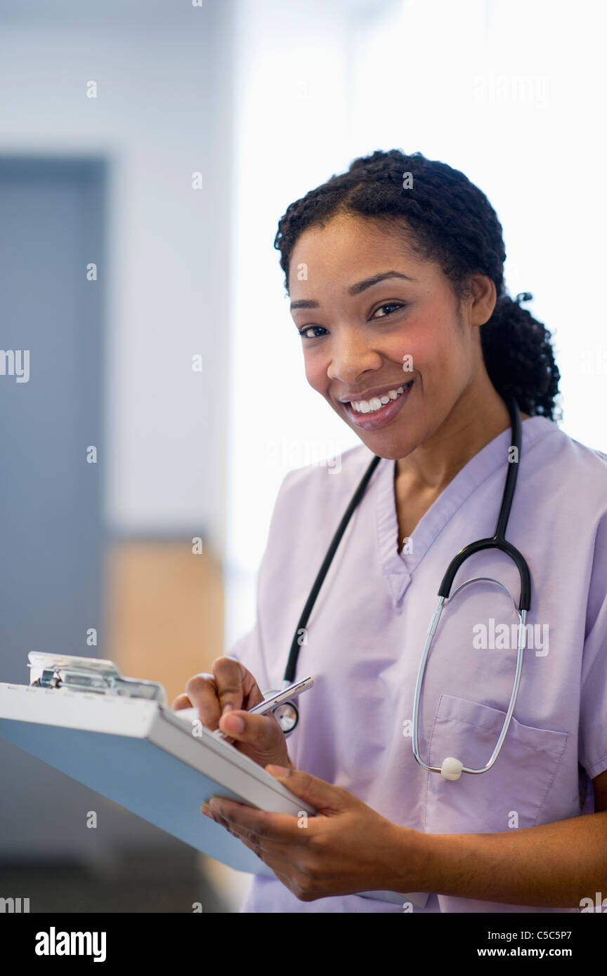 Nurse writing in medical record in hospital Stock Photo Alamy