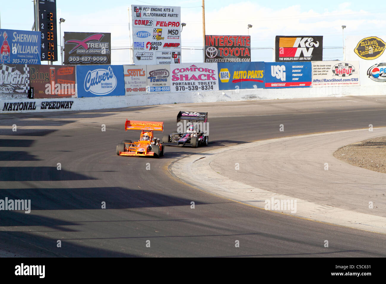 Denver, Colorado - Joe Gallegos in the #14 car leads Matt Gilbert in the #54 car during an ERA Superstock race. Stock Photo