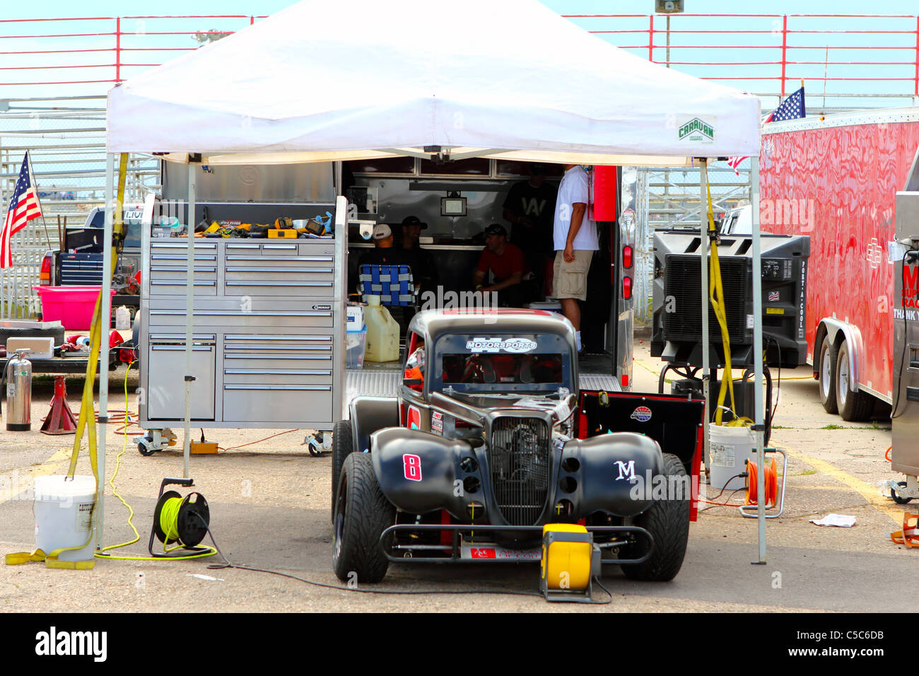Denver, Colorado John Krizman's Legends Race car and the crew team await the start of the