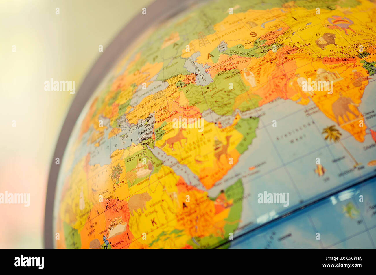 A close-up of Desktop Globe on table focused on Middle East. Stock Photo