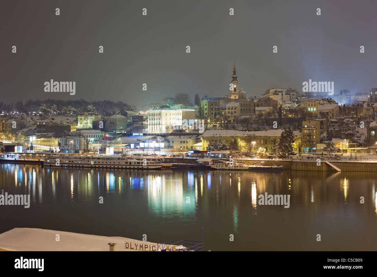 Belgrade city at winter night, snow, river Sava, Serbia Stock Photo