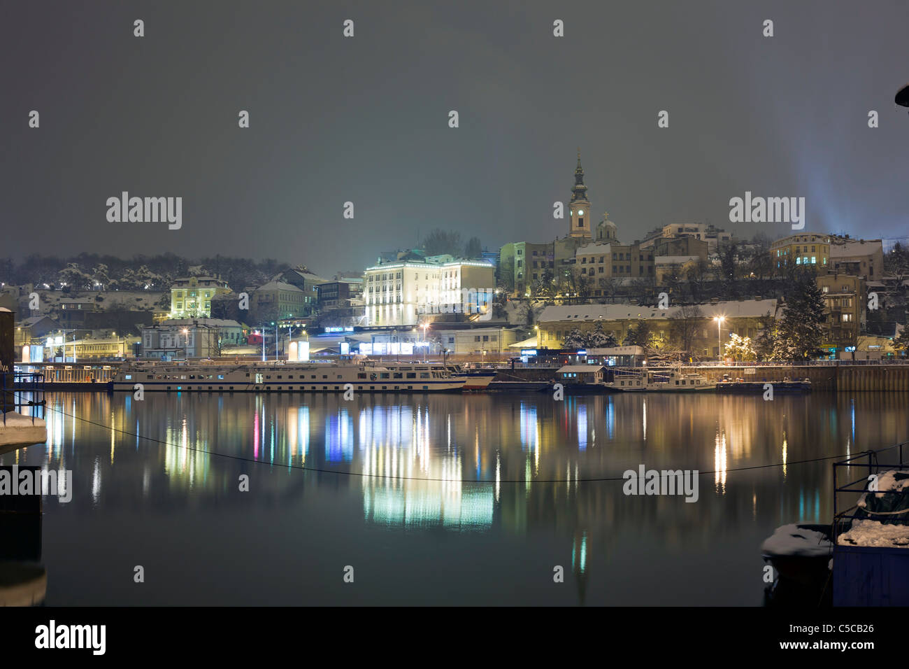 Belgrade city at winter night, snow, river Sava, Serbia Stock Photo