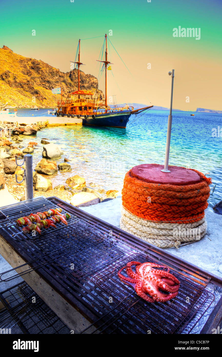 Grilled octopus and prawn skewers on the barbecue in Santorini Greece