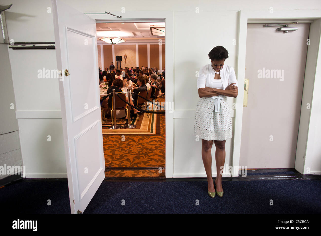 First Lady Michelle Obama waits to be introduced during an event at the Claremont Hotel Club Stock Photo