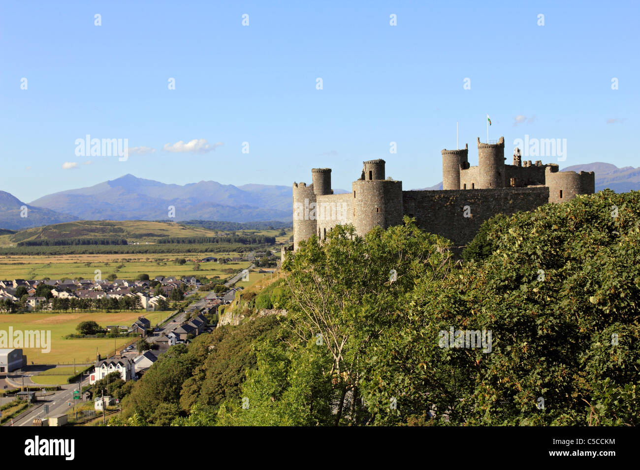 Harlech castle with the triangular peak of Mount Snowdon in the distance, Gwynedd, Wales UK Stock Photo