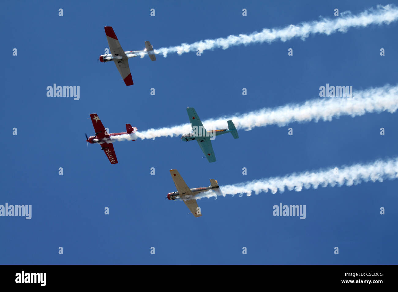 Four aircraft fly in formation Stock Photo - Alamy