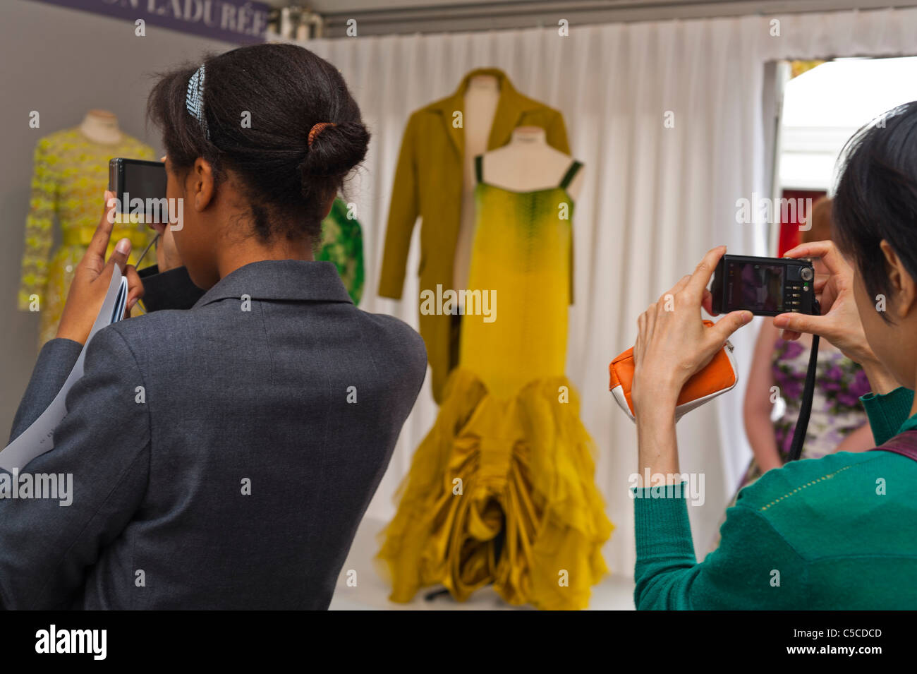 Paris, France, Over Shoulder, Teens Taking Photos, "Didier Ludot", Vintage Dresses Display, at