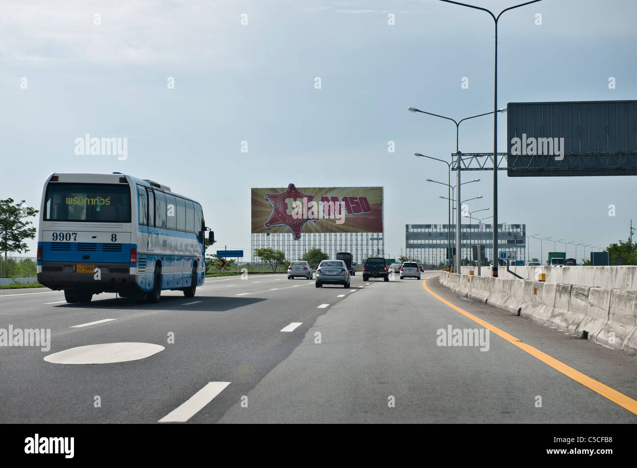 On the highway to Pattaya. Many big advertisement bill boards are adorning the Thai highways. Stock Photo