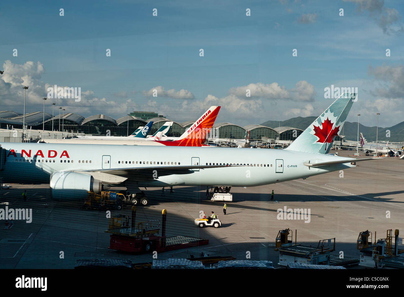 Hong Kong International Airport. Afternoon at Chek lap Kok, Hong Kong International Airport. With Air Canada and Air India. Stock Photo