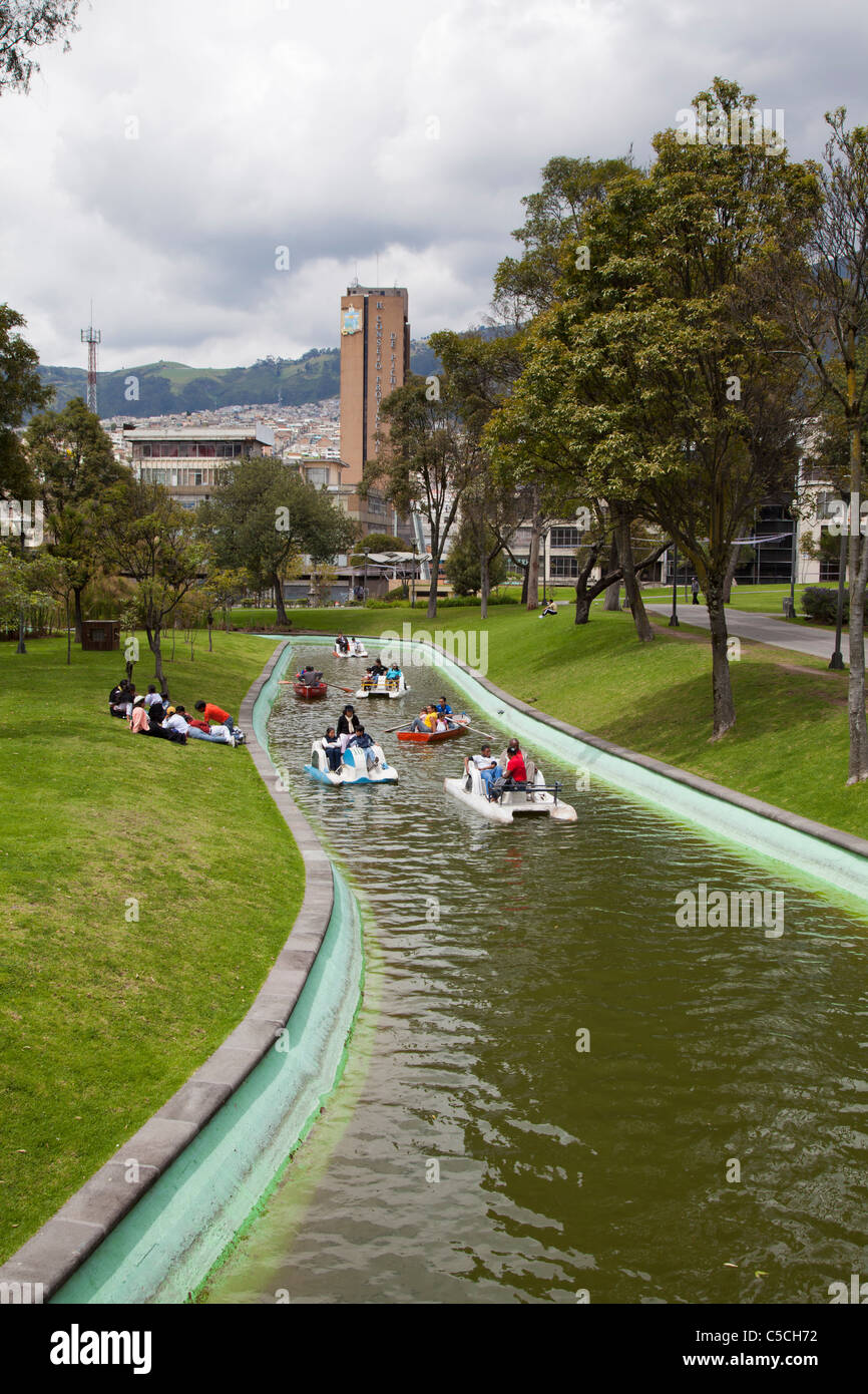 Families paddle-boating on the water in La Alameda park, Quito, Ecuador Stock Photo