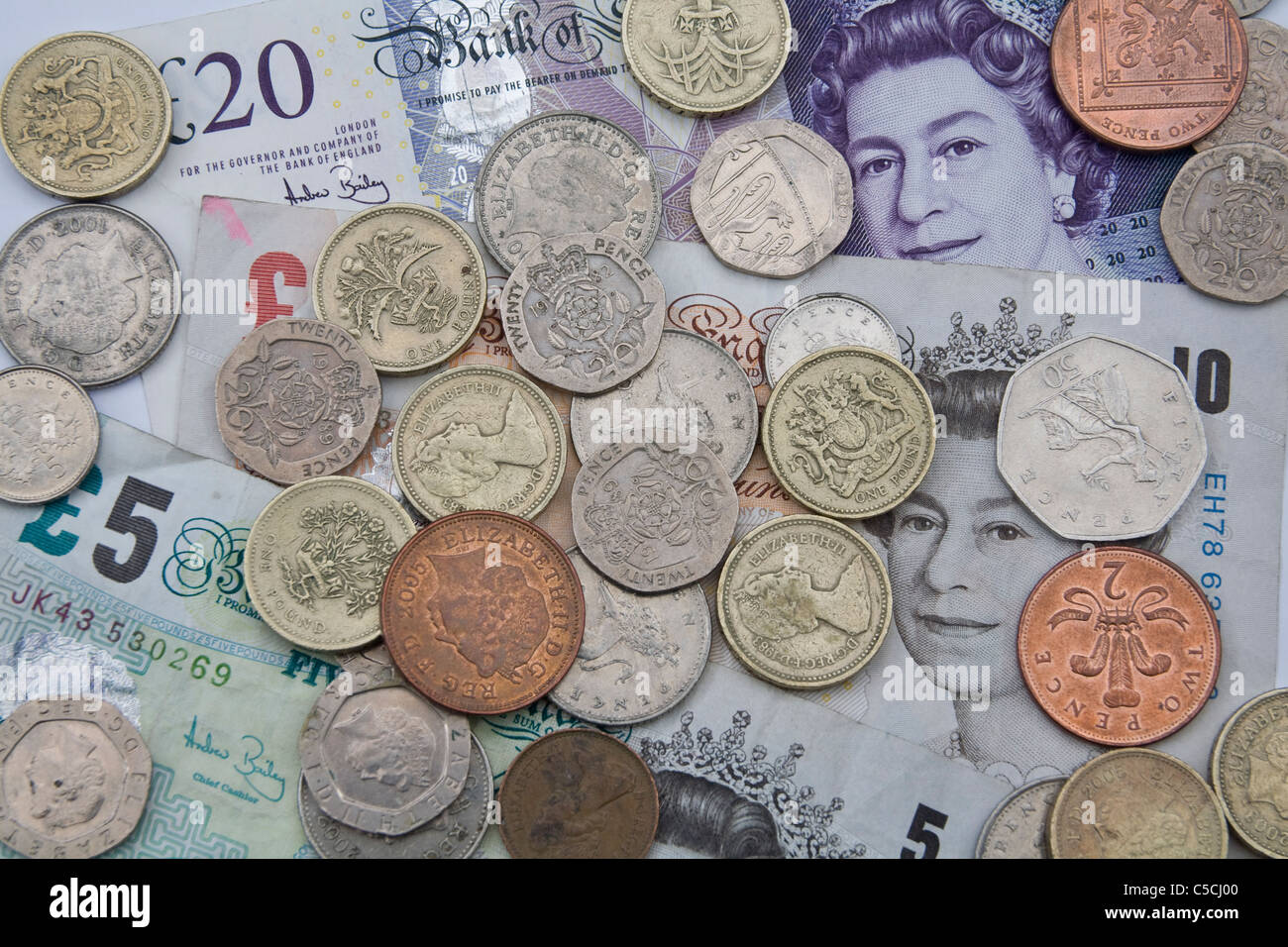 Selection of sterling currency notes and coins Stock Photo - Alamy