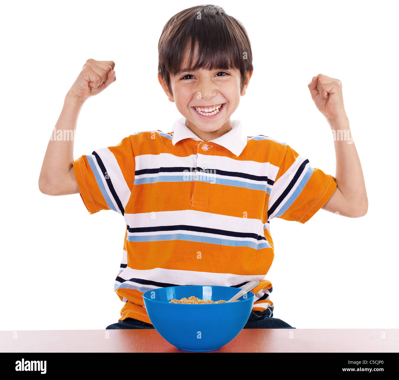 Young boy shows his strength by raising his arms on isolated white background Stock Photo