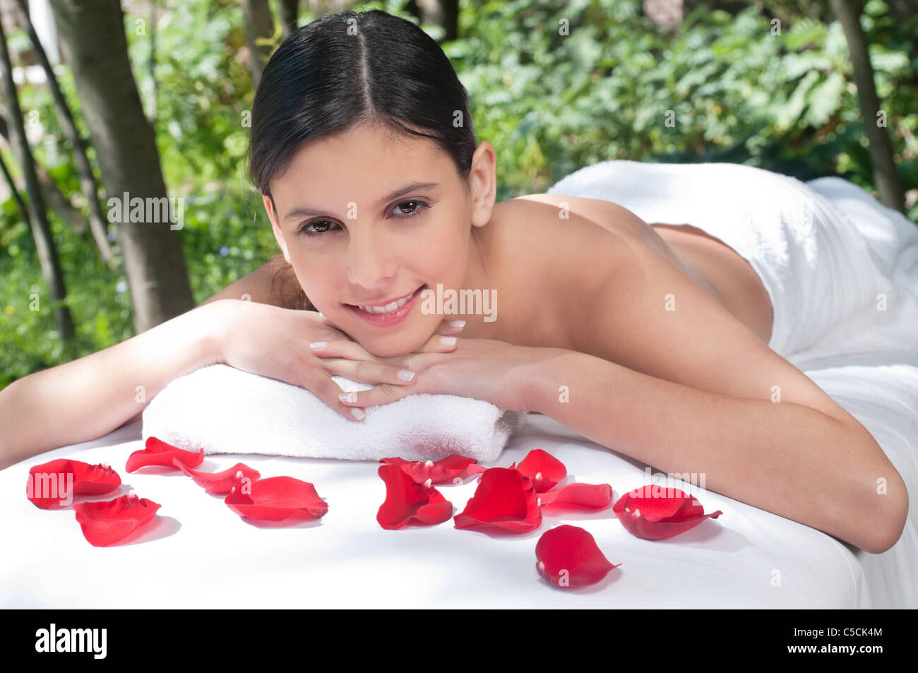 Beautiful young woman relaxing at spa in a natural setting Stock Photo ...