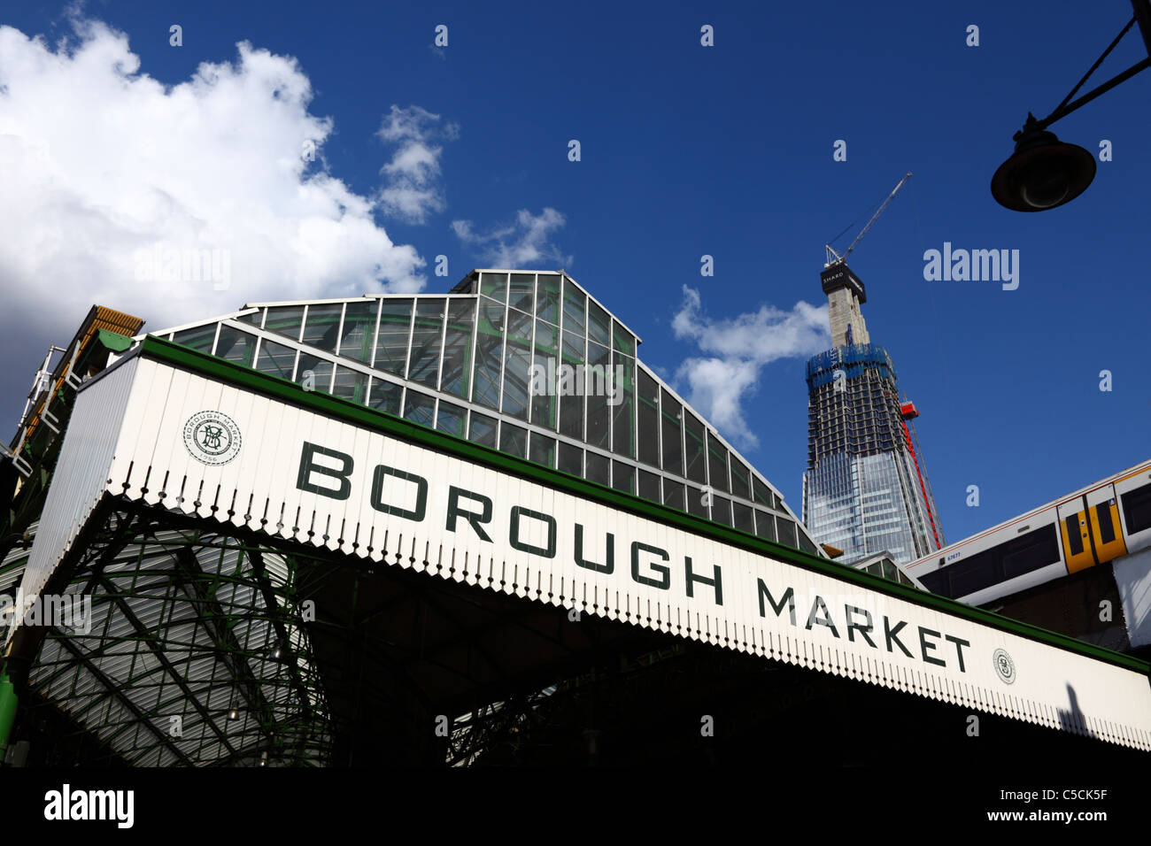 Entrance to Borough Market, Shard London Bridge Building under construction in background, Southwark, London, England Stock Photo