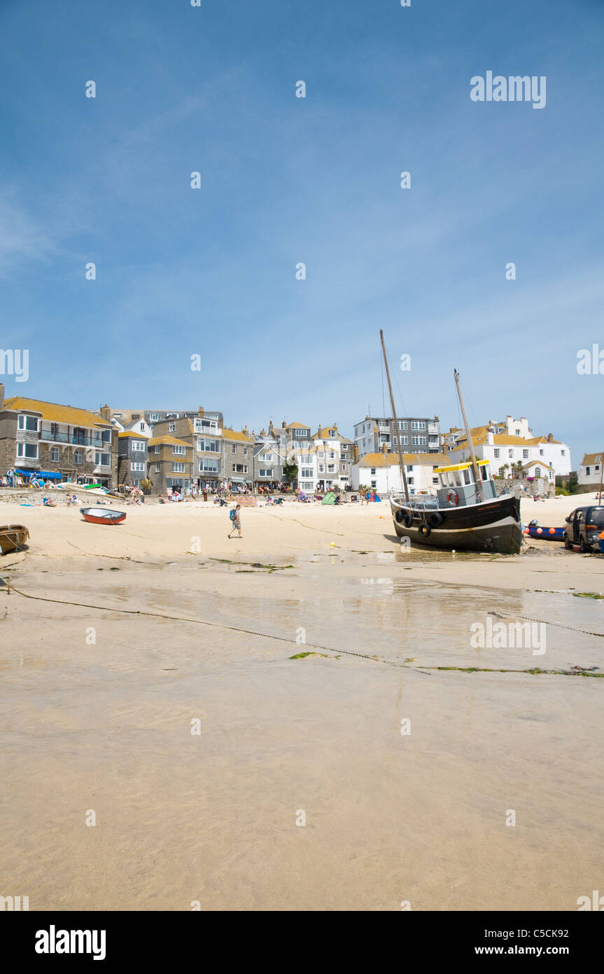 St Ives Harbour, at low tide, with boats, blue sky and sandy beach. Cornwall, UK. Stock Photo