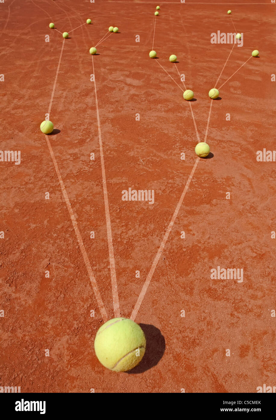 Business metaphor with tennis balls on cort Stock Photo