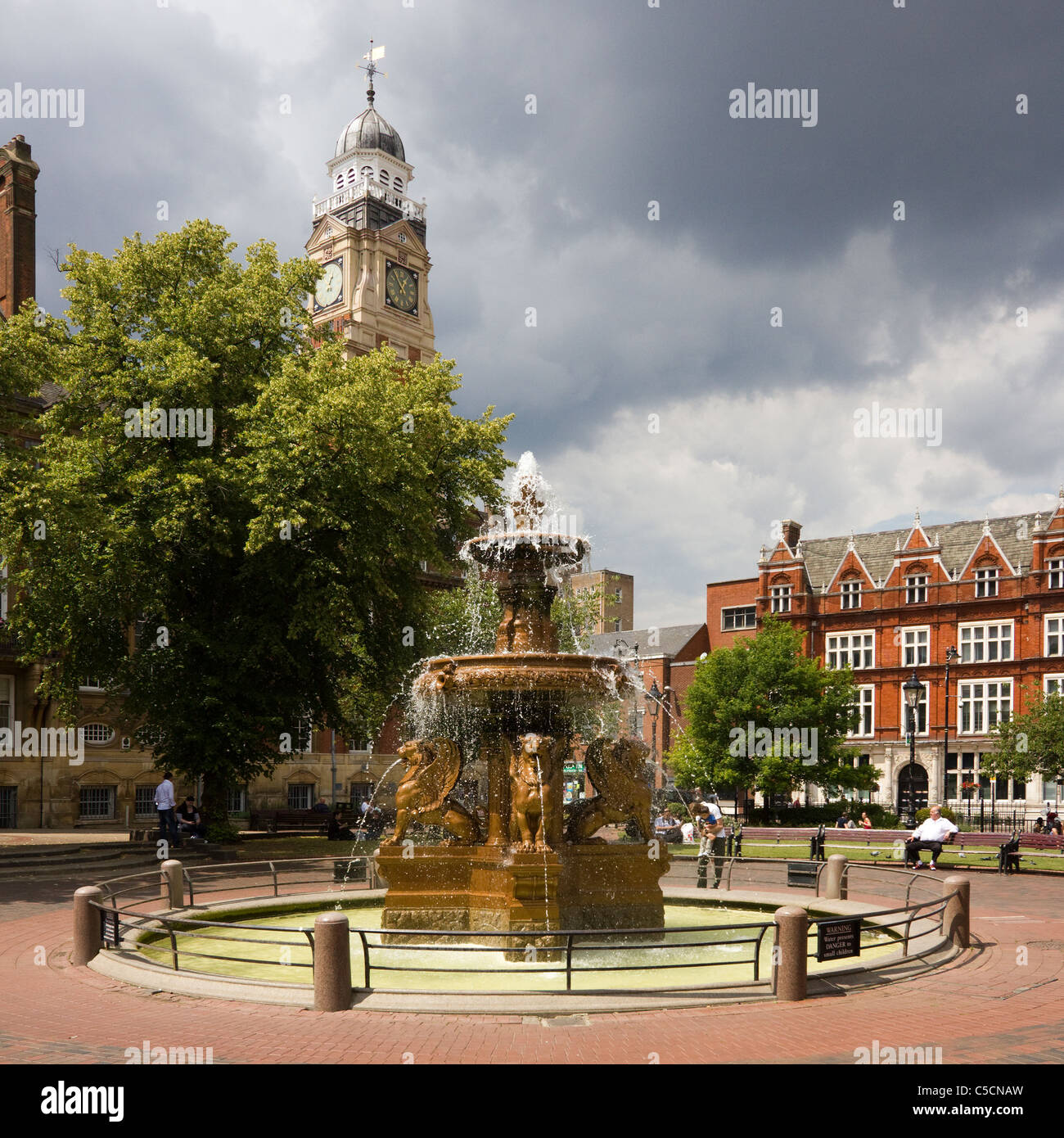 Ornamental water fountain with Town Hall clock tower beyond, Town Hall Square, Leicester