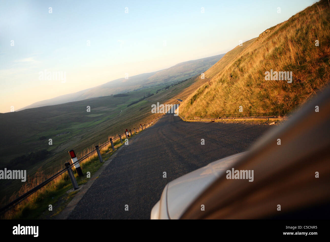 Car driving on road in the Yorkshire Dales Stock Photo