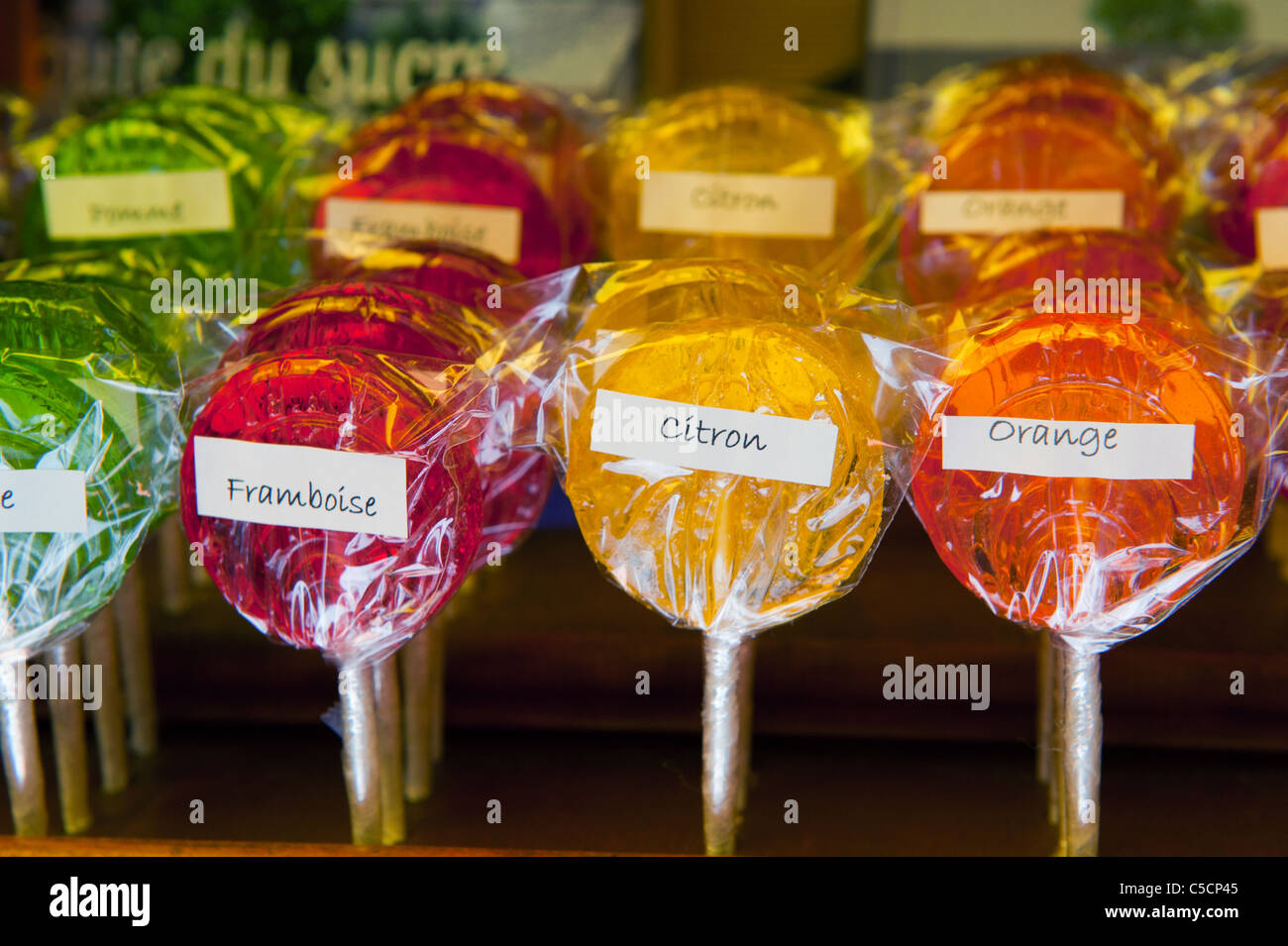 Sweet French fruit lollipops in different colors Stock Photo - Alamy