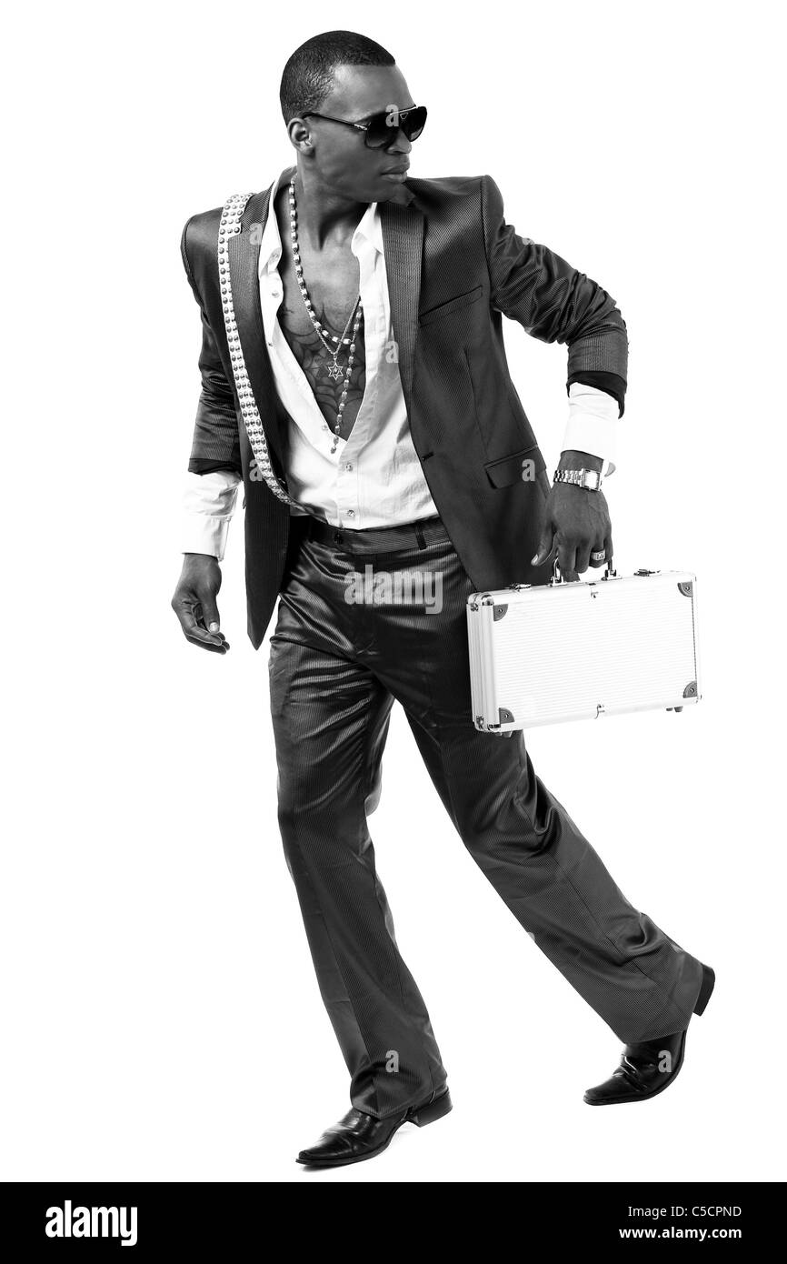Drug dealer escape from the police with lots of money on silver briefcase Stock Photo