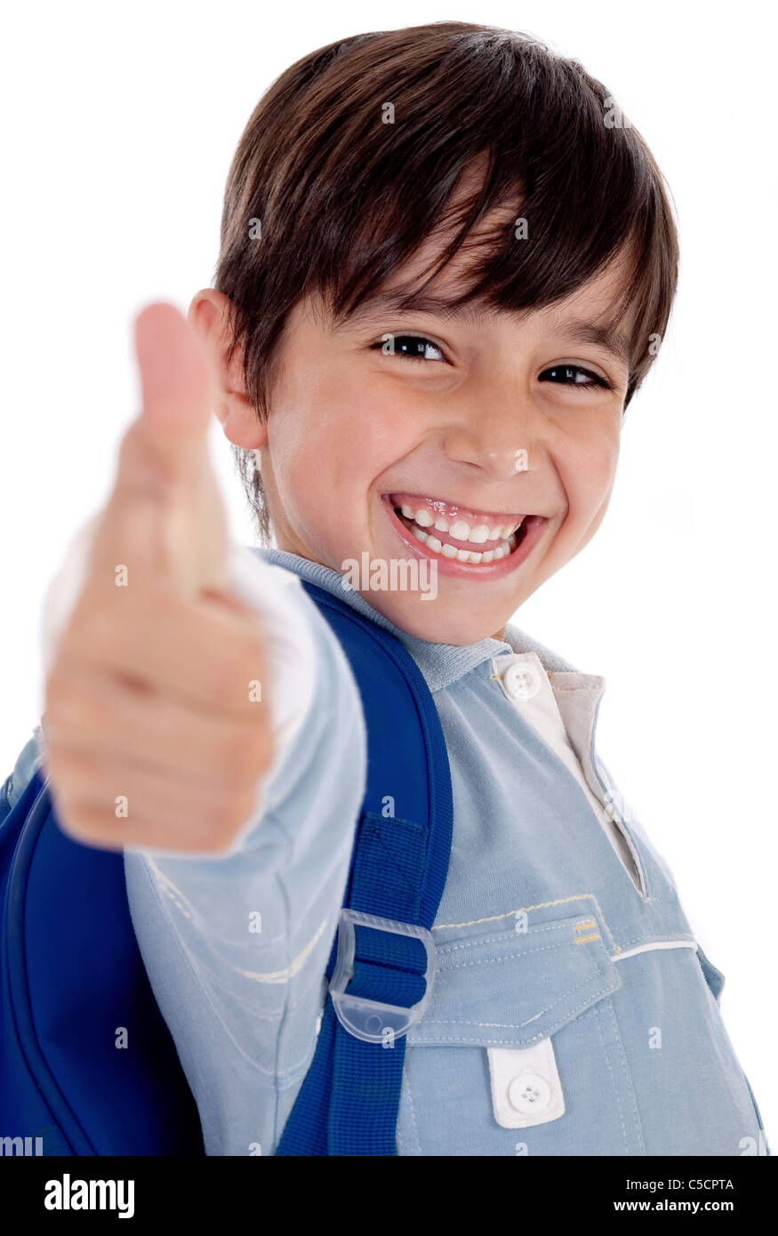 Smiling kinder garden boy gives thumbs up on isolated white background Stock Photo