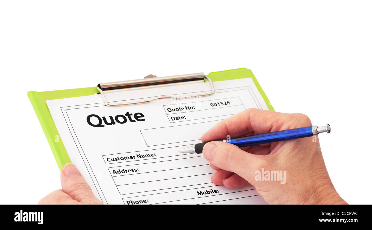 Hand with Pen Writing a Quote Stock Photo