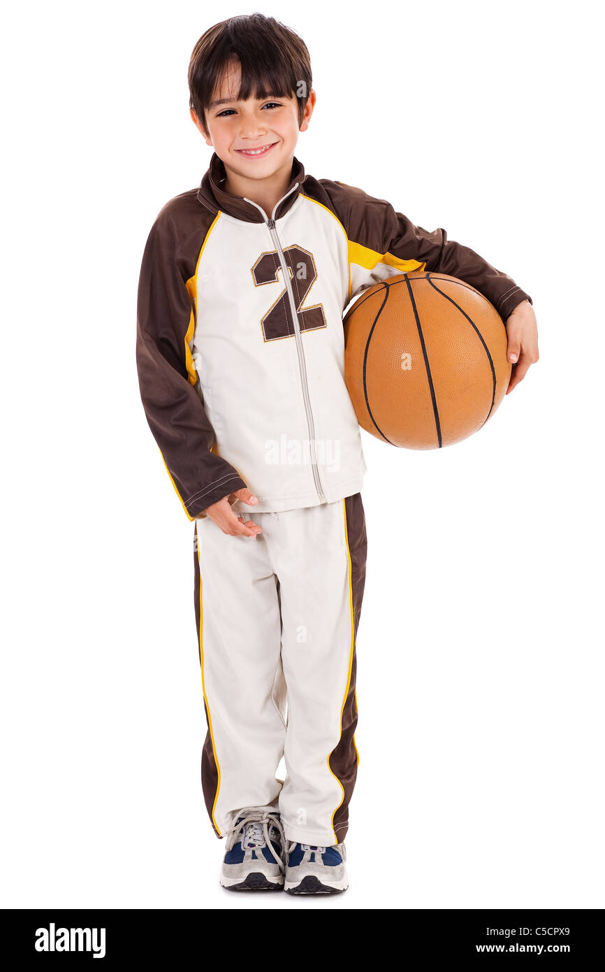 Adorable young kid in his sports dress with ball on isolated white background Stock Photo