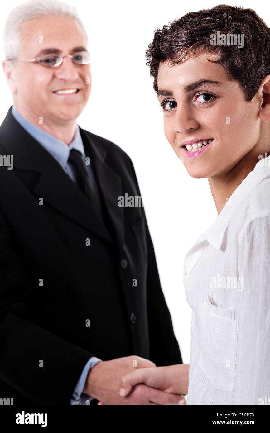 Business man handshake with a young boy on isolated white background Stock Photo